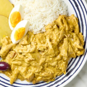 Ají de Gallina 
 Tender shredded chicken bathed in a velvety, mildly spicy yellow-ají sauce, served over jasmine rice.