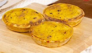 
Mini Pastel de Choclo 
Sweet corn pies layered with chicken, beef, and fresh basil.