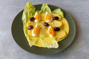 Papa a la Huancaína 
Tender potatoes topped with a creamy, mildly spicy cheese sauce.