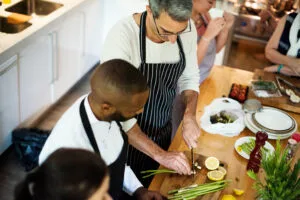 Group of friends cooking in the kitchen